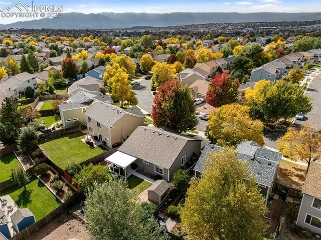 an aerial view of a house with a lake view