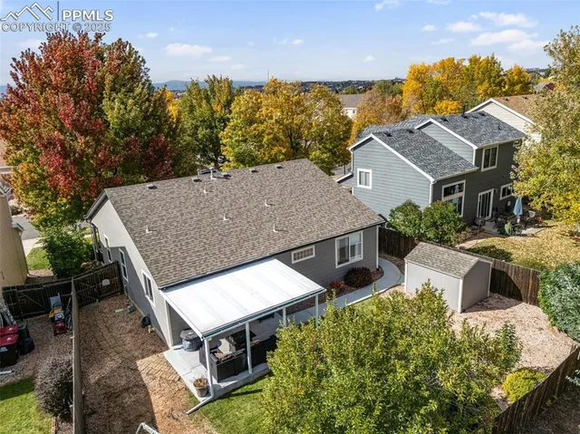 an aerial view of a house with swimming pool