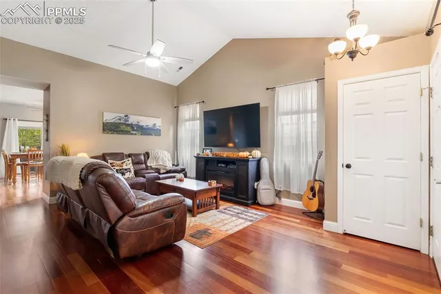 a living room with furniture and a flat screen tv