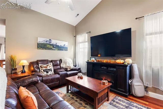 a living room with furniture and a flat screen tv