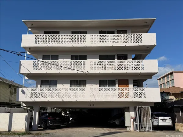 a view of a car park in front of house