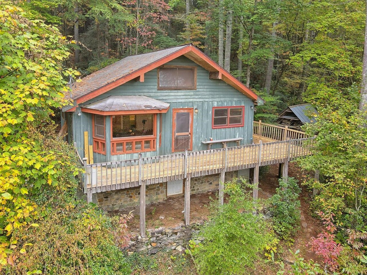 a view of a house with a yard and sitting area