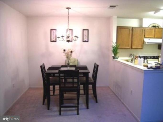7808 Harrowgate Circle, Unit C Springfield, VA 22152 - Photo 3 of 12 a view of a dining room with furniture