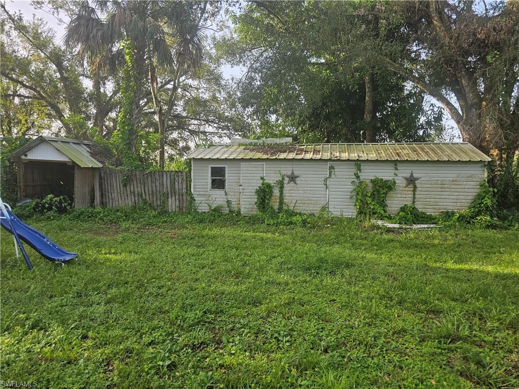 14140 Cemetery Road Fort Myers, FL 33905 - Photo 3 of 6 a view of a house with backyard and garden