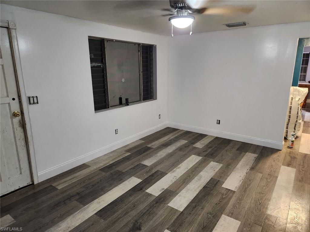 14140 Cemetery Road Fort Myers, FL 33905 - Photo 6 of 6 en empty room with wooden floor and fan