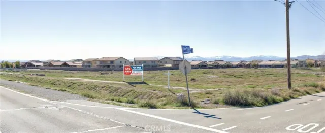 a view of a terrace with a garden and lake view