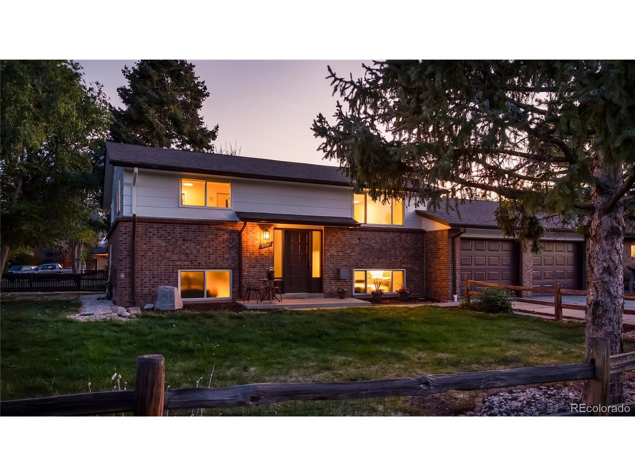 9395 West 45th Avenue Wheat Ridge, CO 80033 - Photo 2 of 48 a view of a house with a yard