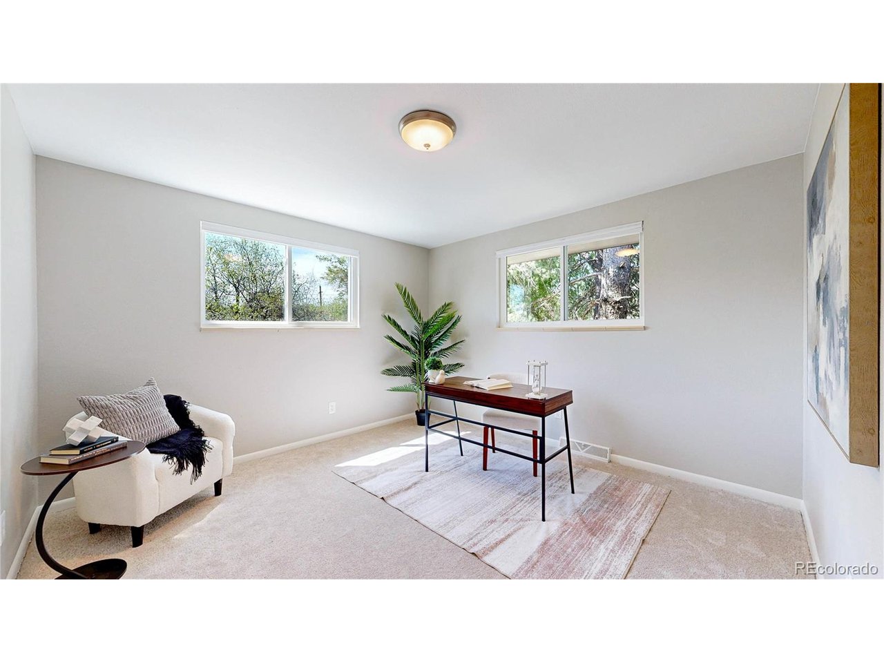 9395 West 45th Avenue Wheat Ridge, CO 80033 - Photo 21 of 48 a living room with furniture and a window