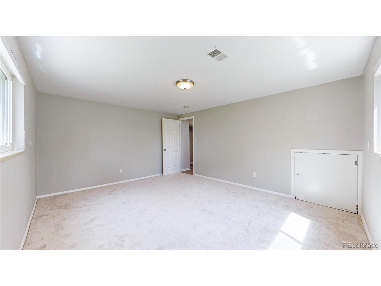 9395 West 45th Avenue Wheat Ridge, CO 80033 - Photo 27 of 48 a open hall with a bench