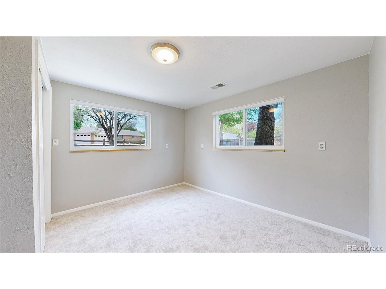 9395 West 45th Avenue Wheat Ridge, CO 80033 - Photo 33 of 48 a black and white photo of a living room
