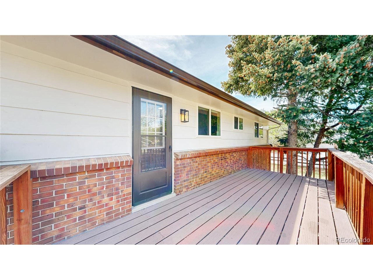 9395 West 45th Avenue Wheat Ridge, CO 80033 - Photo 37 of 48 a view of house with wooden floor and outdoor space
