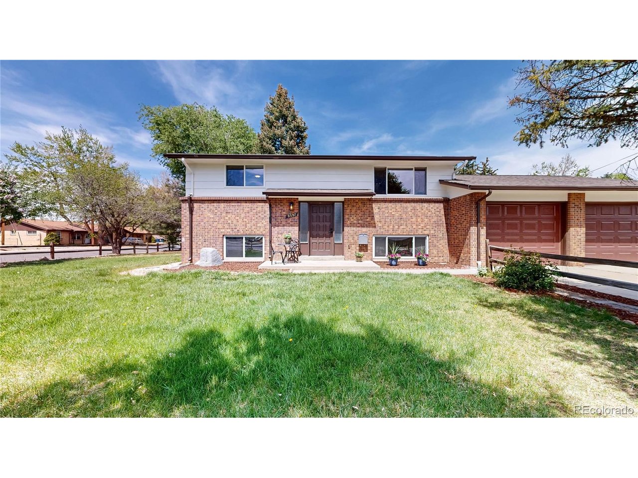9395 West 45th Avenue Wheat Ridge, CO 80033 - Photo 4 of 48 a view of a house with a backyard