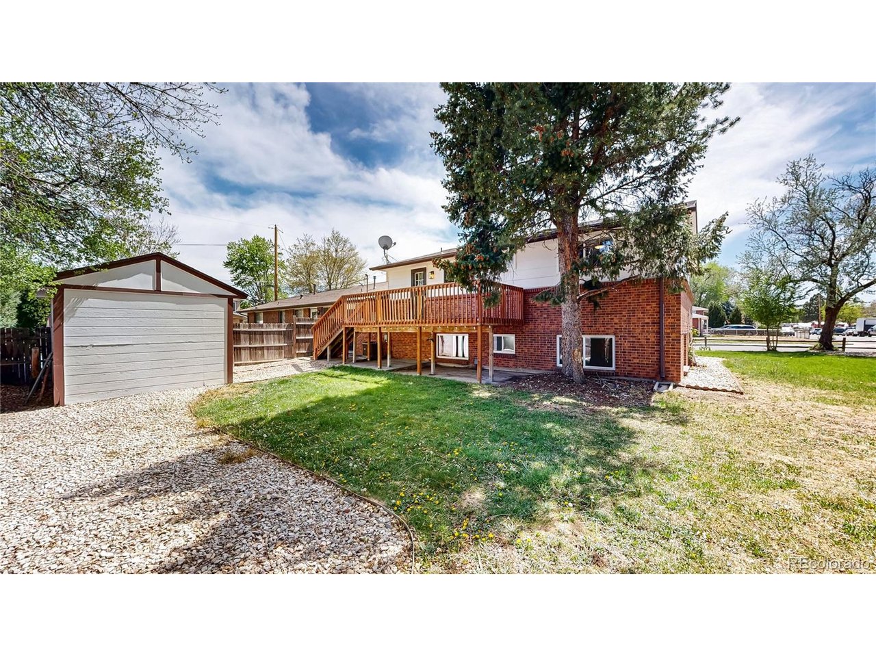 9395 West 45th Avenue Wheat Ridge, CO 80033 - Photo 41 of 48 a backyard of a house with lots of green space
