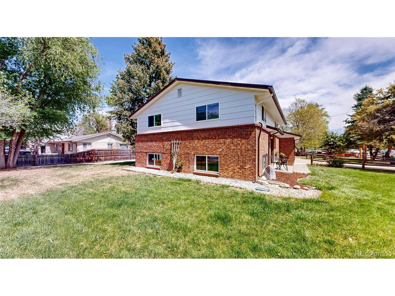 9395 West 45th Avenue Wheat Ridge, CO 80033 - Photo 43 of 48 a house view with a outdoor space