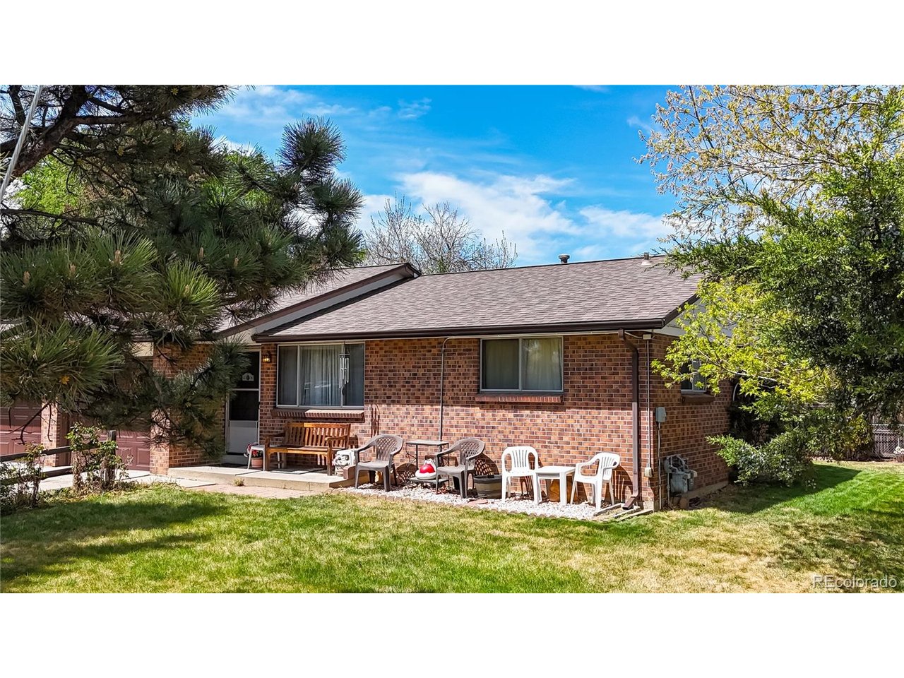 9395 West 45th Avenue Wheat Ridge, CO 80033 - Photo 45 of 48 a view of a house with a yard