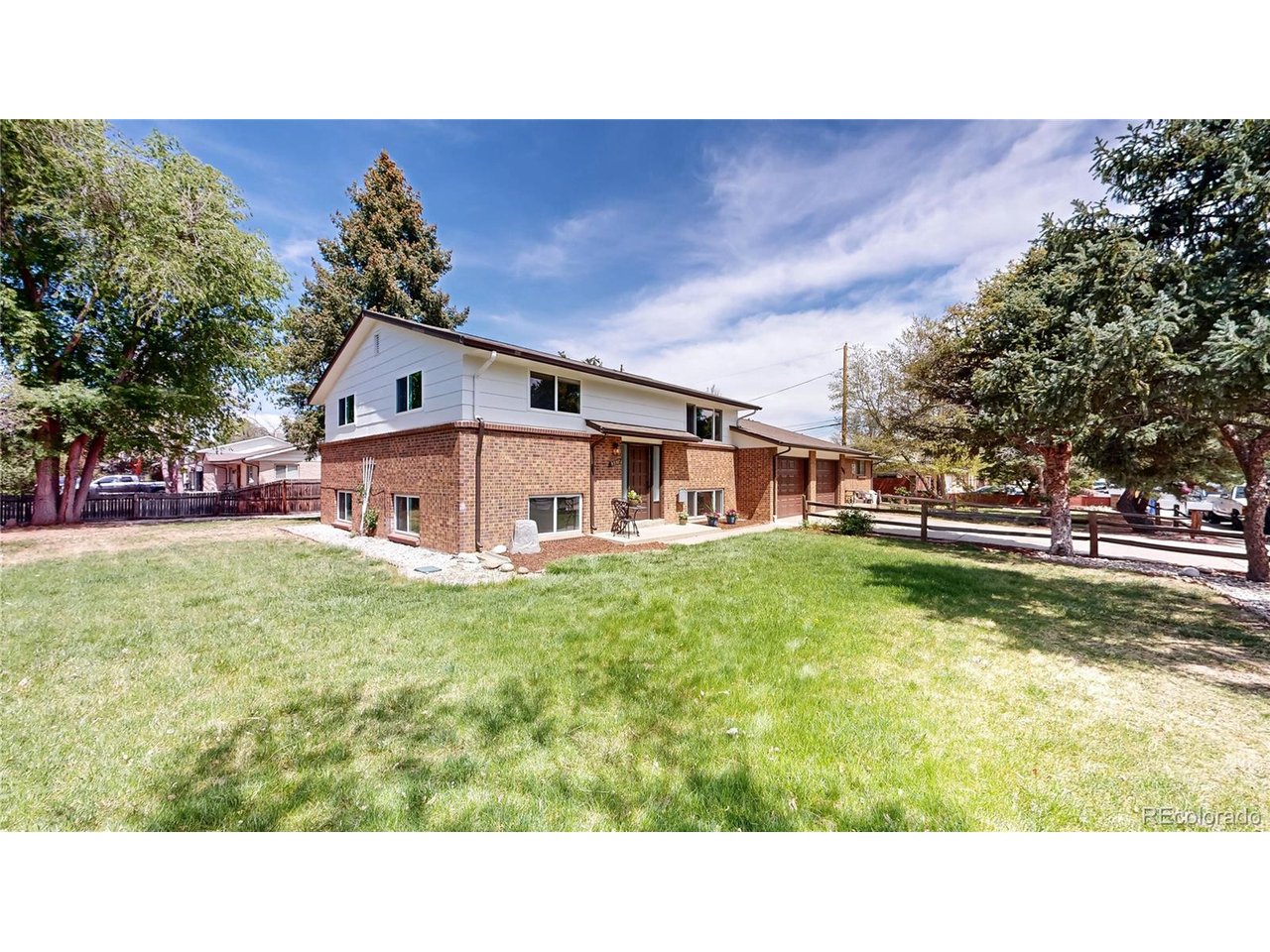 9395 West 45th Avenue Wheat Ridge, CO 80033 - Photo 7 of 48 a swimming pool with outdoor seating and yard