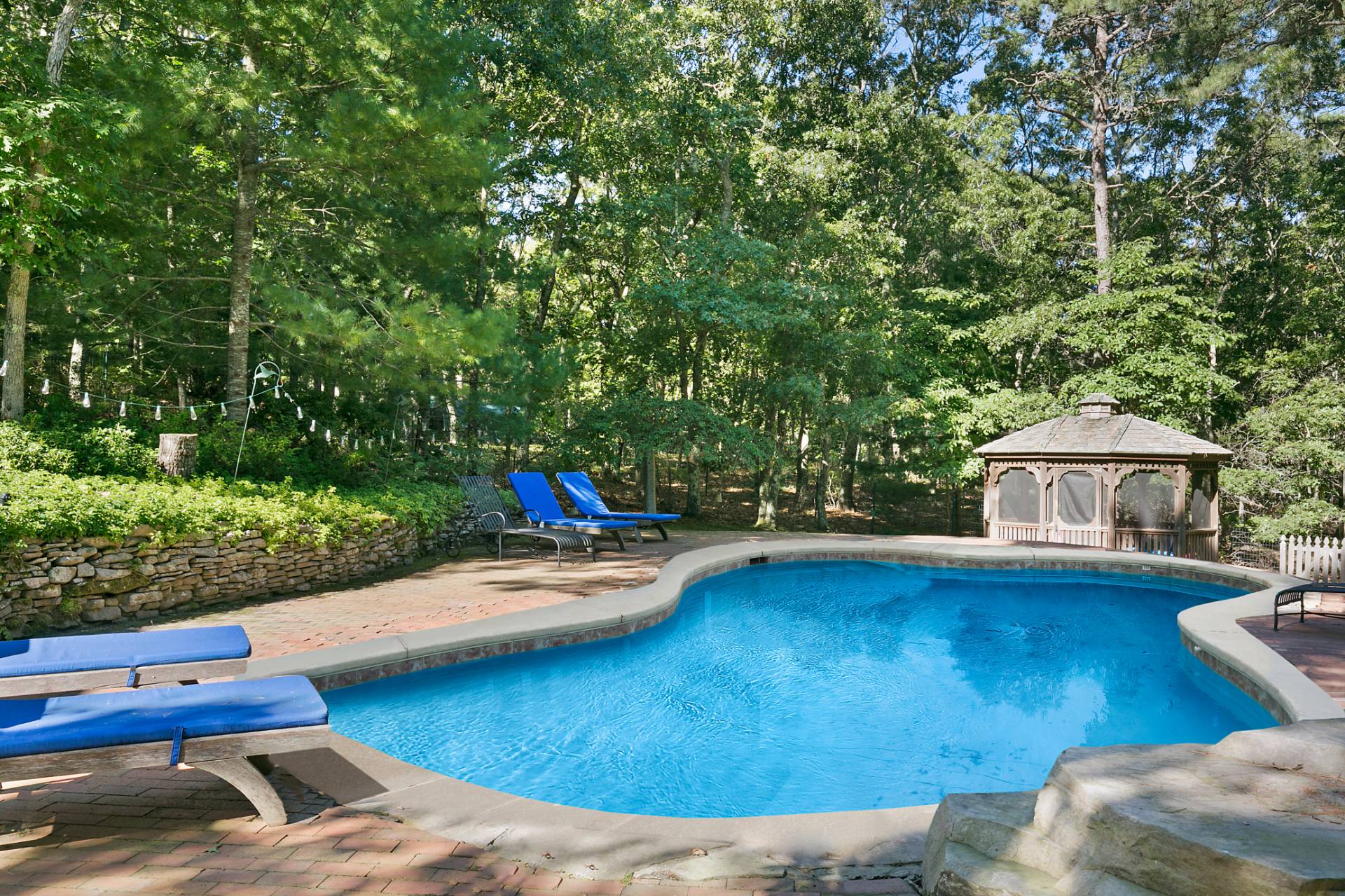 18 Whooping Hollow Road East Hampton, NY 11937 - Photo 14 of 15 a view of a swimming pool with a patio