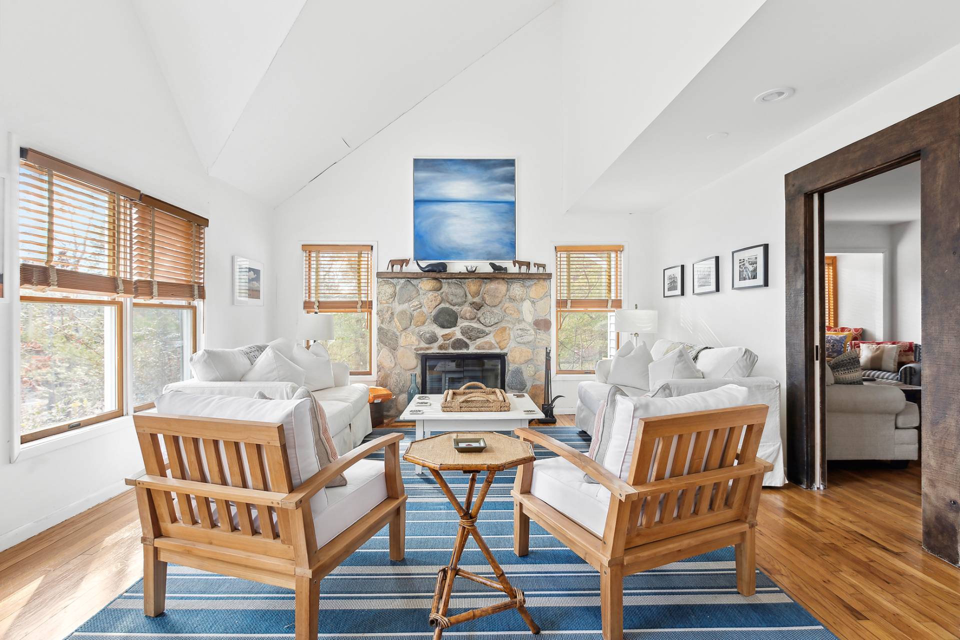 18 Whooping Hollow Road East Hampton, NY 11937 - Photo 3 of 15 a living room with furniture and a fireplace