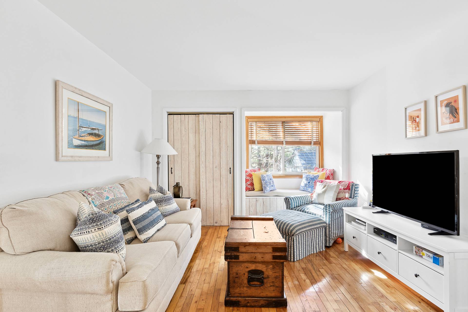 18 Whooping Hollow Road East Hampton, NY 11937 - Photo 6 of 15 a living room with furniture and a flat screen tv