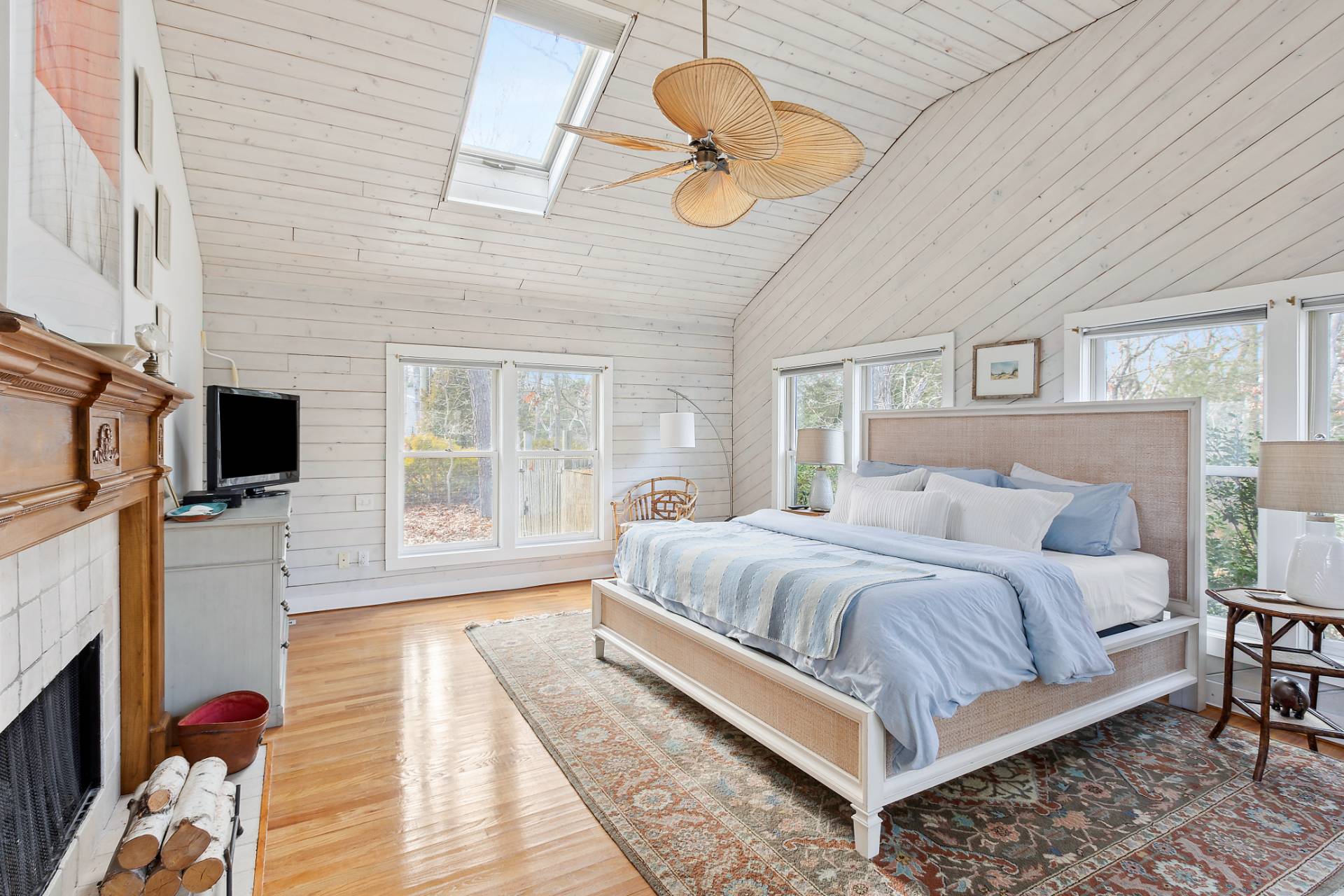 18 Whooping Hollow Road East Hampton, NY 11937 - Photo 7 of 15 a bedroom with a bed a flat screen tv and balcony