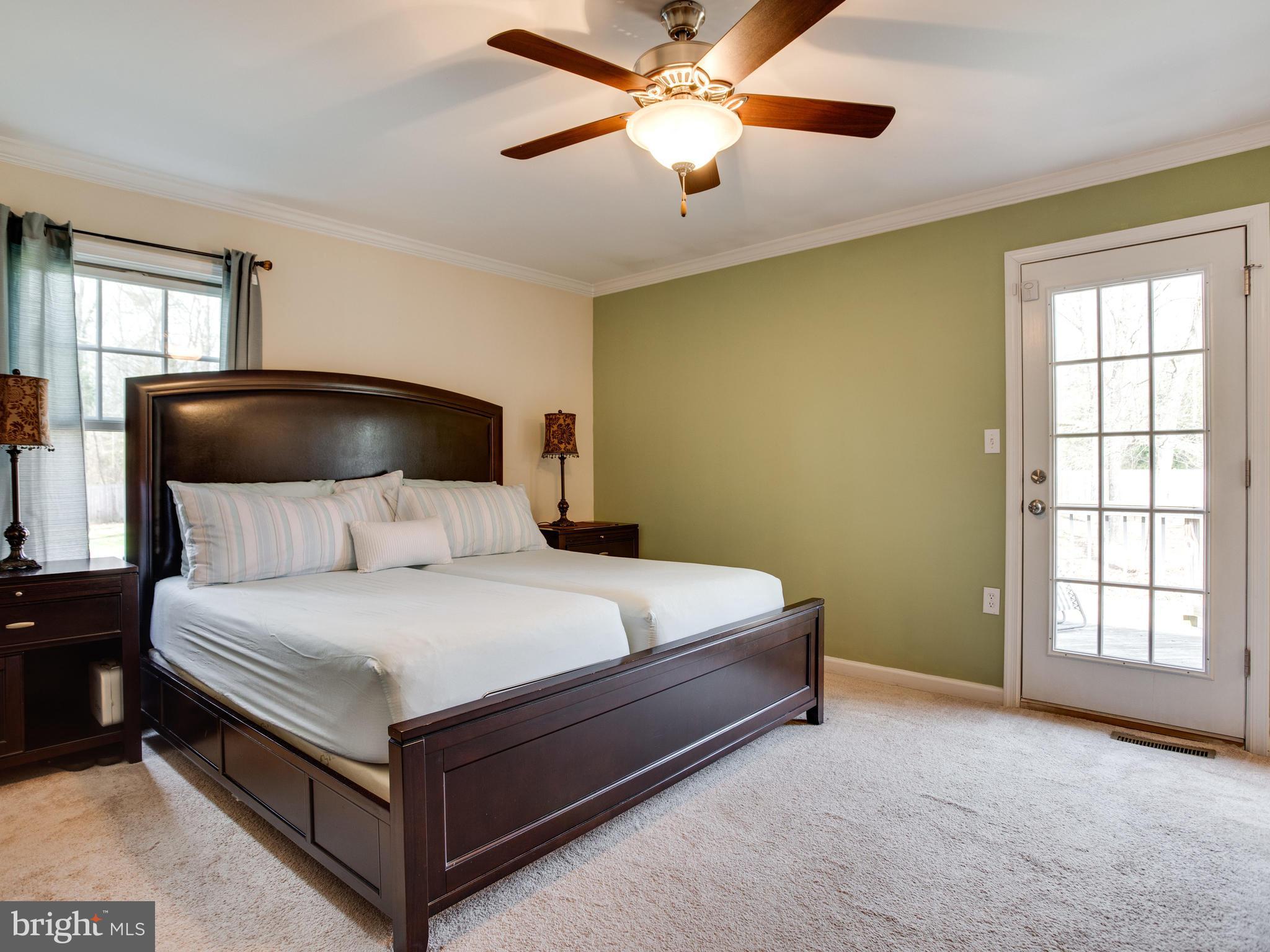 2800 Hambleton Road Riva, MD 21140 - Photo 14 of 30 a bedroom with a bed and a chandelier