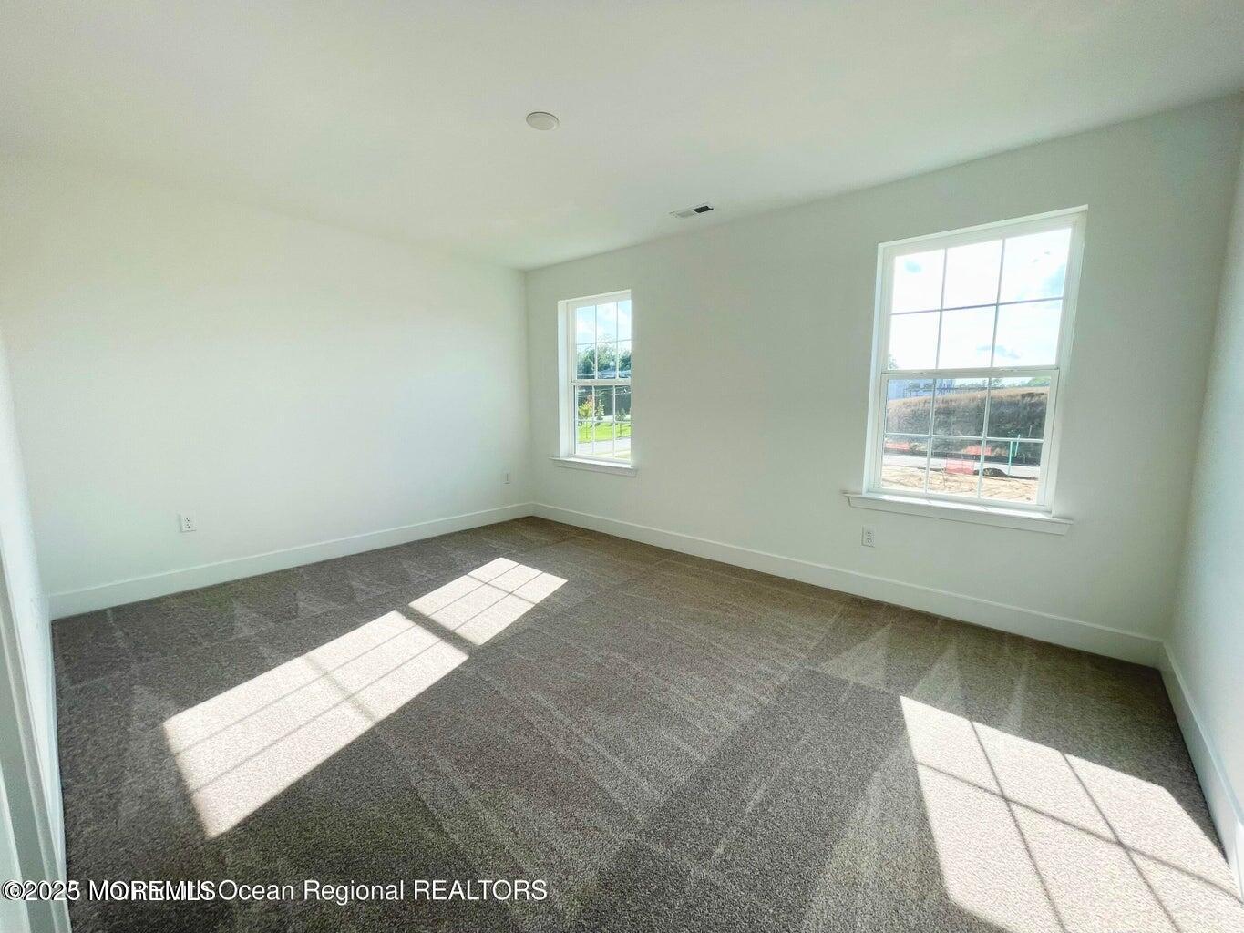 106 Woolley Court Oakhurst, NJ 07755 - Photo 16 of 17 an empty room with a window