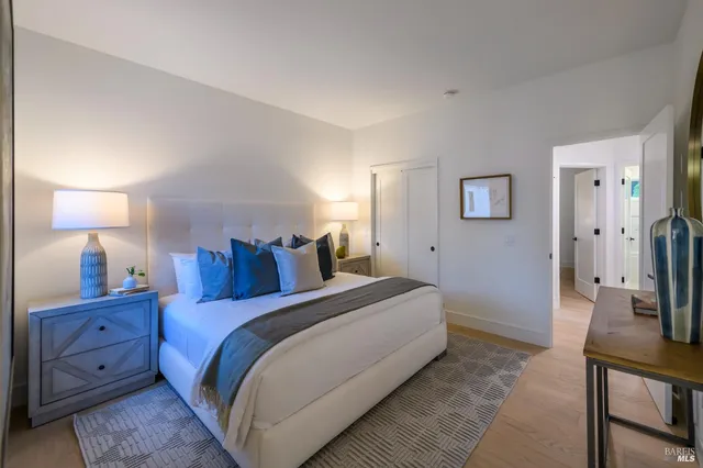 a bed room with a bed and a lamp