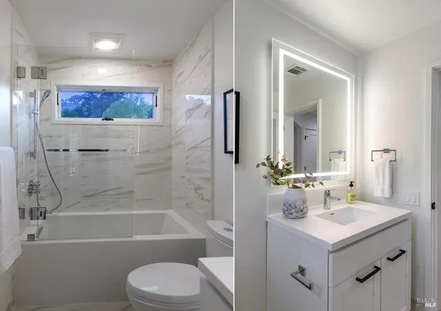 a bathroom with a bathtub shower sink vanity mirror and toilet