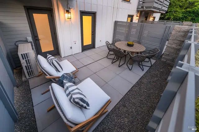 a view of an outdoor sitting area with furniture
