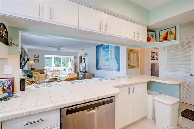 a open kitchen with stainless steel appliances granite countertop a sink and cabinets