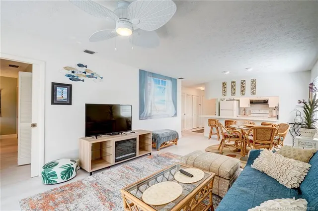 a living room with furniture a table and a window