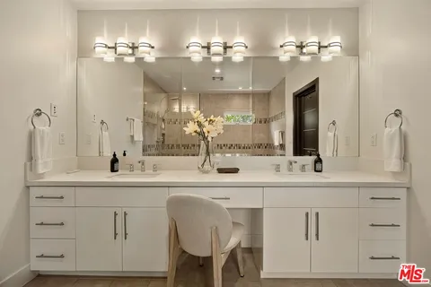 a bathroom with a tub and a shower