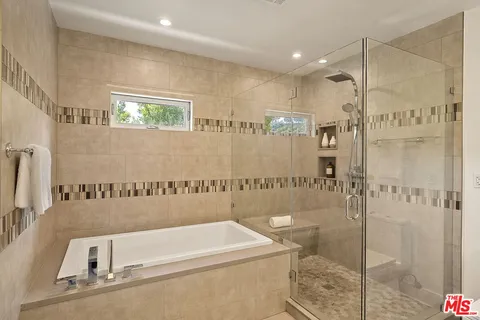 a view of a hallway with a white refrigerator