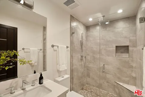 a utility room with sink dryer and washer