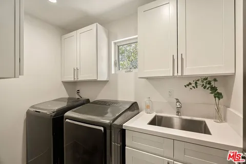 a bathroom with a sink vanity and a mirror