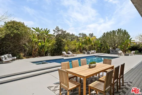 a view of a patio with swimming pool