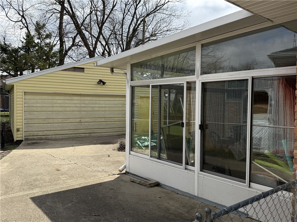 4732 Lehigh Drive Springfield, OH 45503 - Photo 2 of 27 This property features a functional garage and an enclosed patio, ideal for outdoor enjoyment.