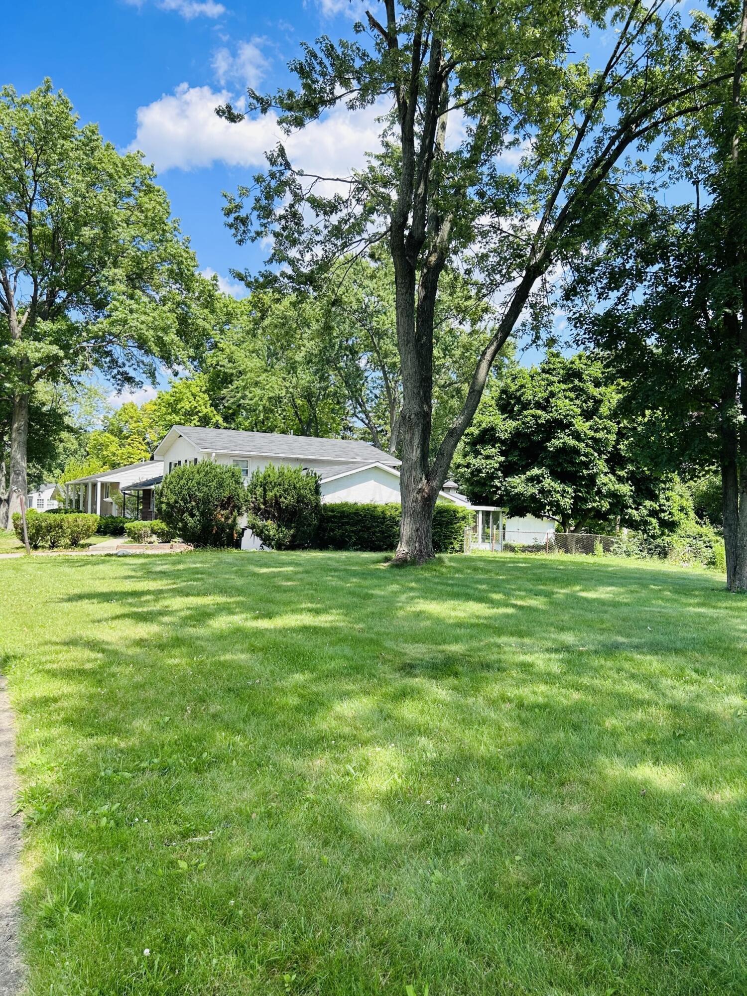 generous yard with mature trees
