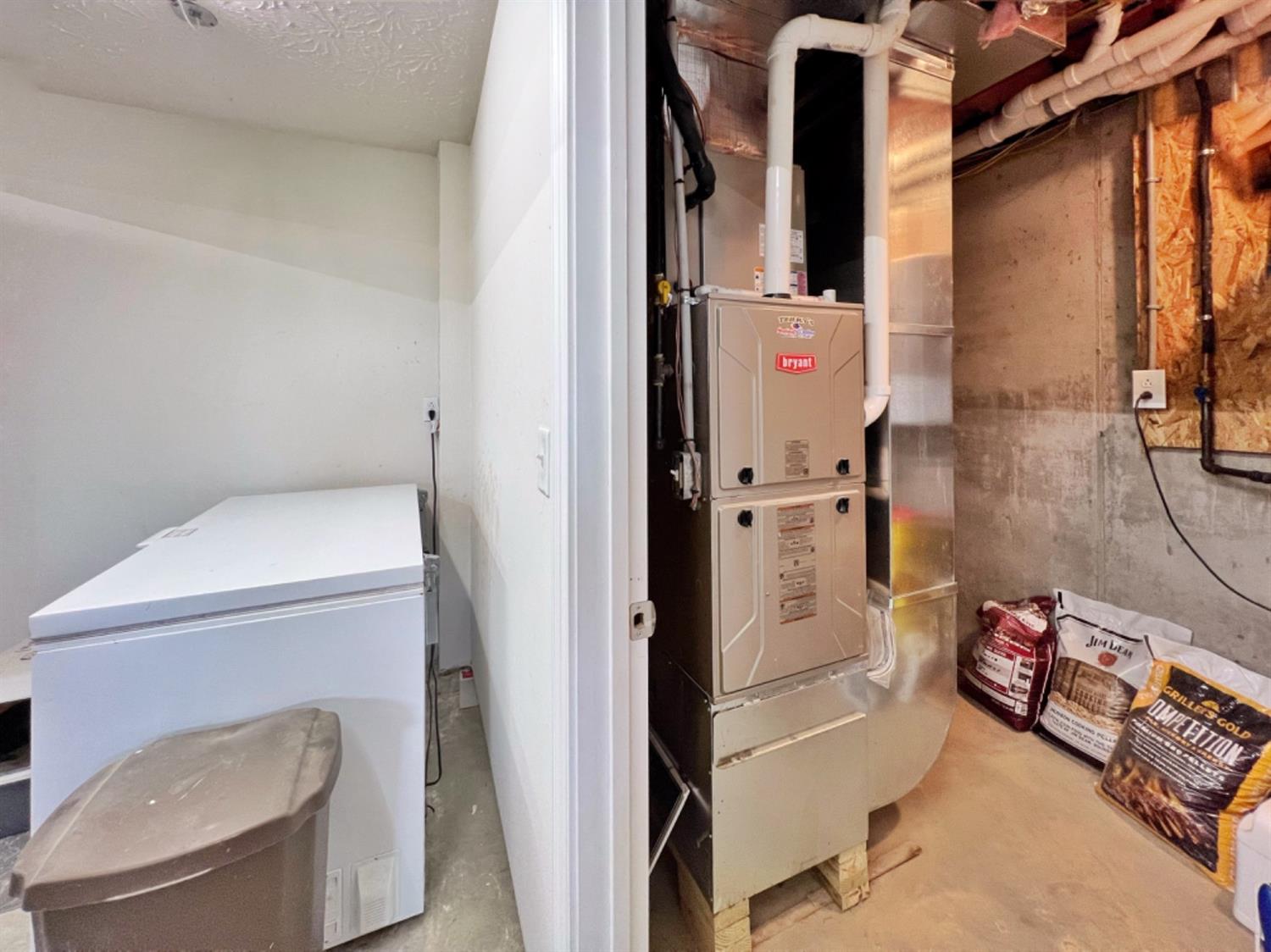 171 South Ridge Lane Versailles, IN 47042 - Photo 71 of 72 GAS FURNACE UTILITY ROOM WITH A TANKLESS WATER HEATER AND WATER SOFTENER