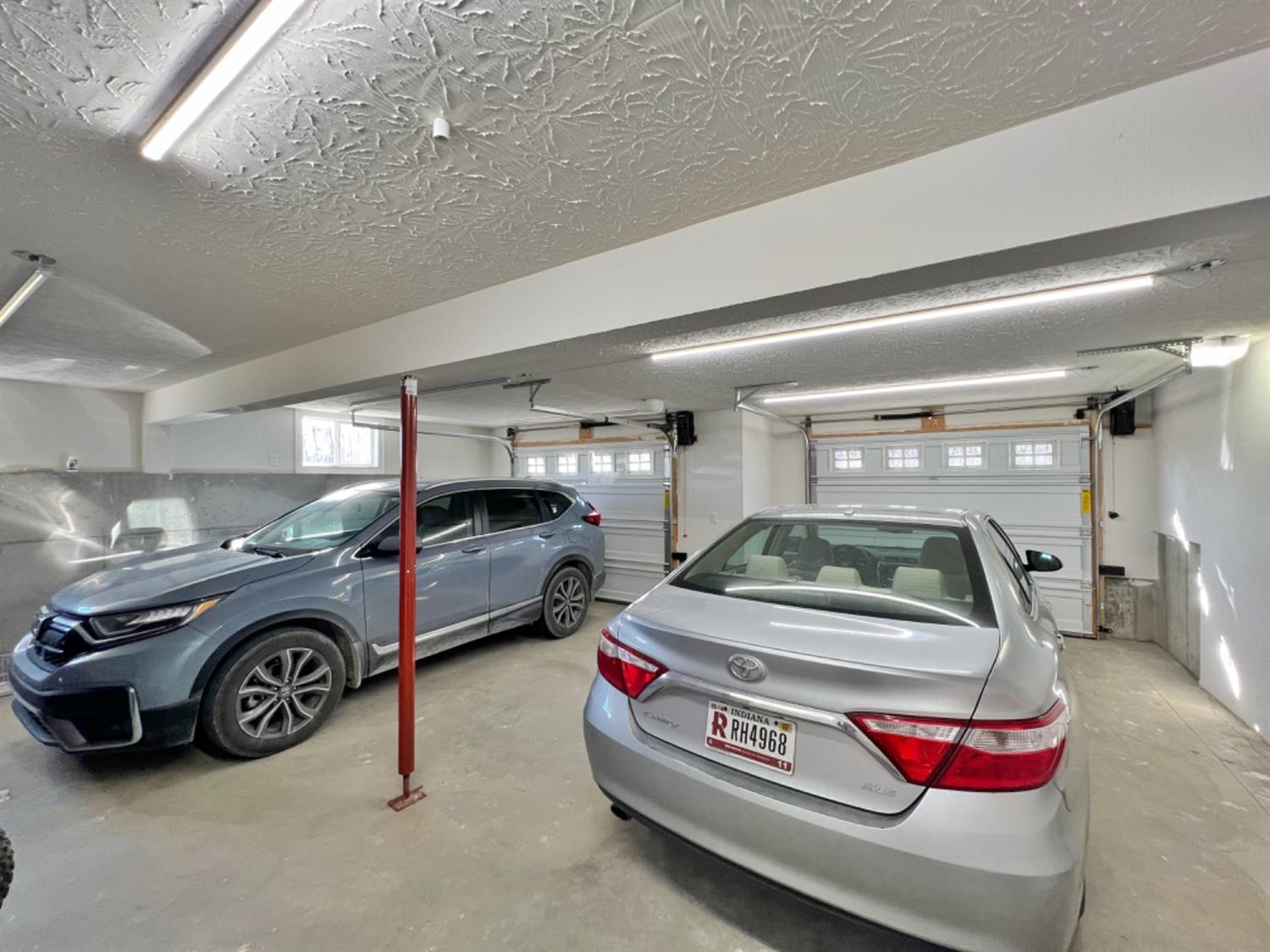171 South Ridge Lane Versailles, IN 47042 - Photo 72 of 72 BRIGHT OVERSIZED 2 CAR GARAGE WITH ROOM FOR A WORKSHOP