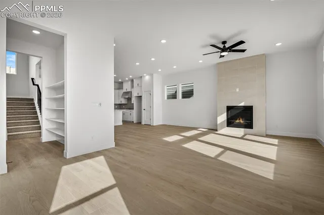 a view of an empty room with a fireplace