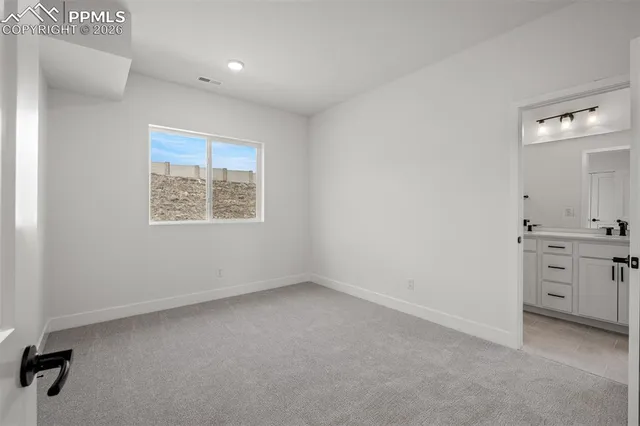 an empty room with a dresser