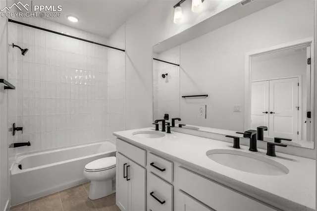 a bathroom with a sink a toilet and a bathtub