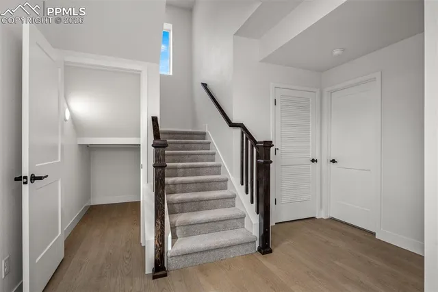 a view of entryway with wooden floor