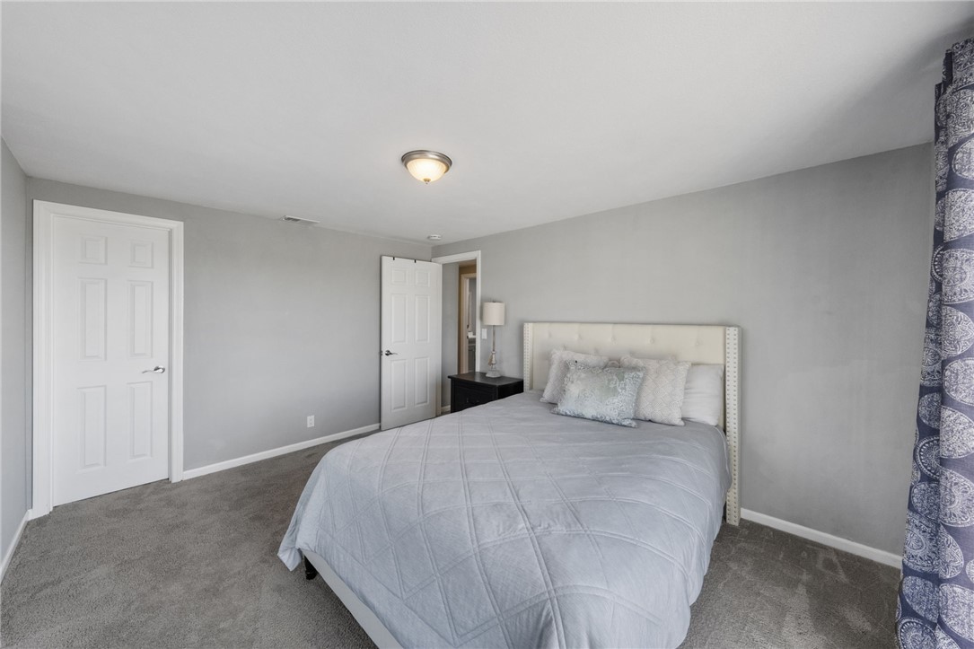 35825 Meadow Ridge Road Temecula, CA 92592 - Photo 51 of 75 a bedroom with a bed and a night stand