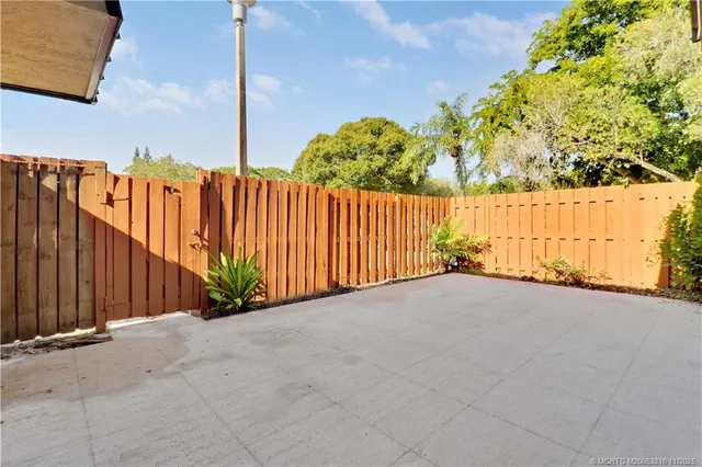 a view of a pathway with a yard