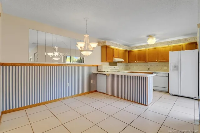 a view of a kitchen with a sink