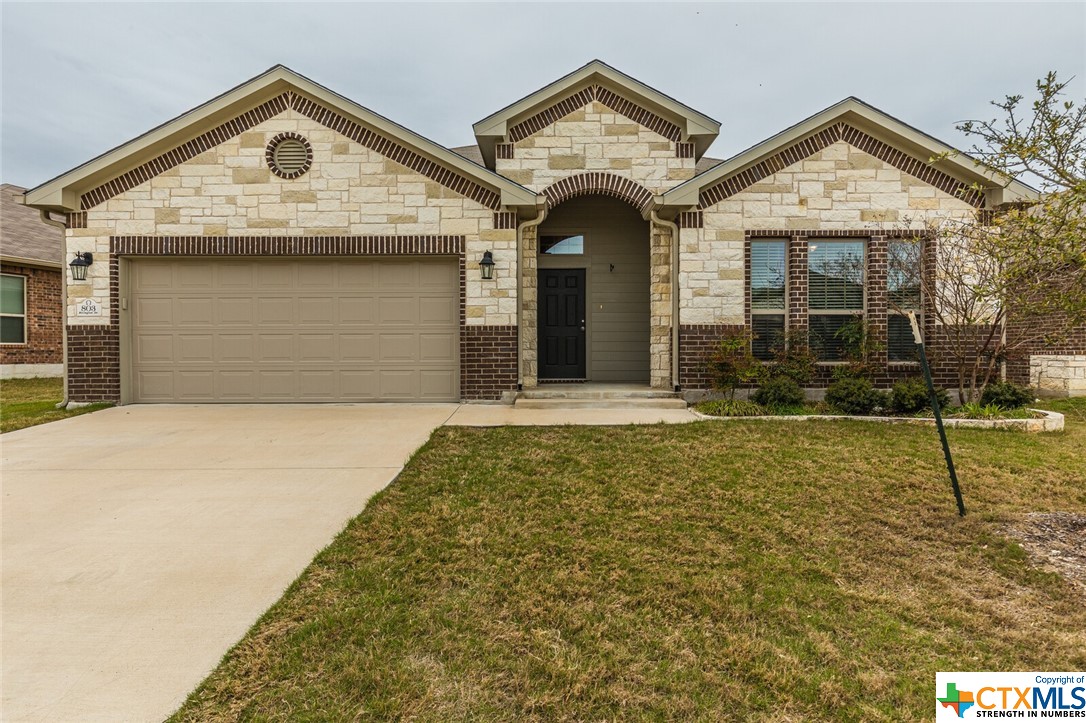 a view of a white house with large windows