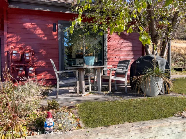 a view of house with a yard