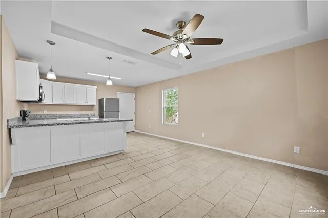 a kitchen with stainless steel appliances cabinets a sink and a counter top space